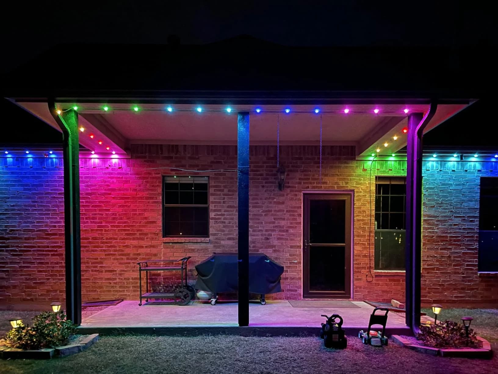 RGBW pixel lighting installed around a covered residential patio and roofline